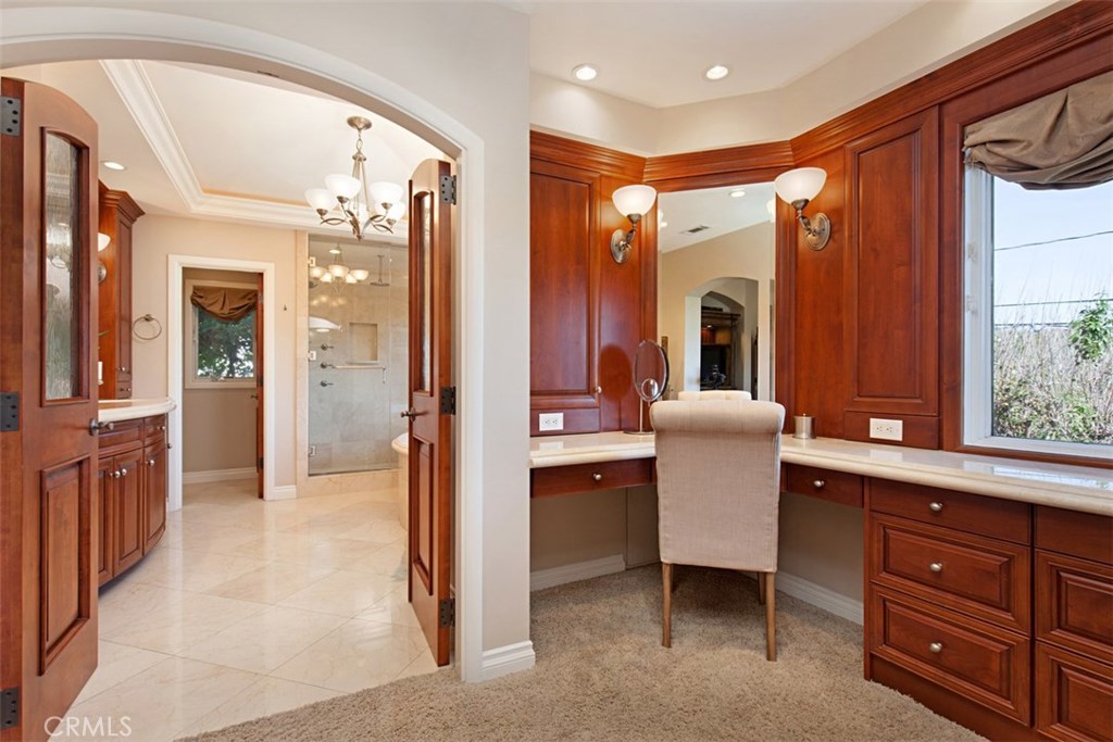 13032 St Thomas Drive North Tustin, CA 92705 - Photo 15 of 32 a bathroom with a sink a mirror and a shower