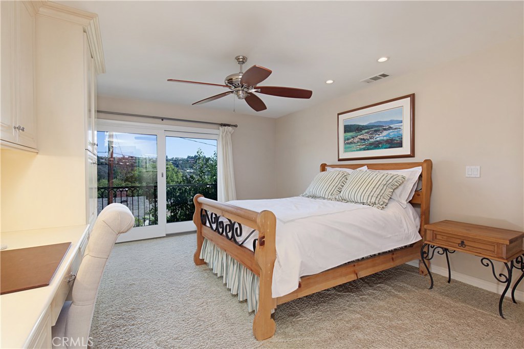 13032 St Thomas Drive North Tustin, CA 92705 - Photo 18 of 32 a bedroom with a bed and a large window