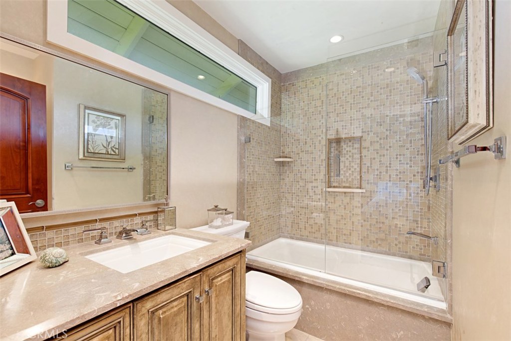 13032 St Thomas Drive North Tustin, CA 92705 - Photo 19 of 32 a bathroom with a granite countertop sink toilet and shower