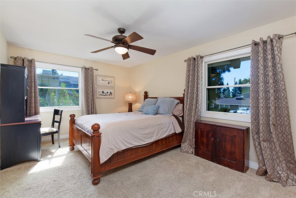 13032 St Thomas Drive North Tustin, CA 92705 - Photo 22 of 32 a bed room with a bed and a window