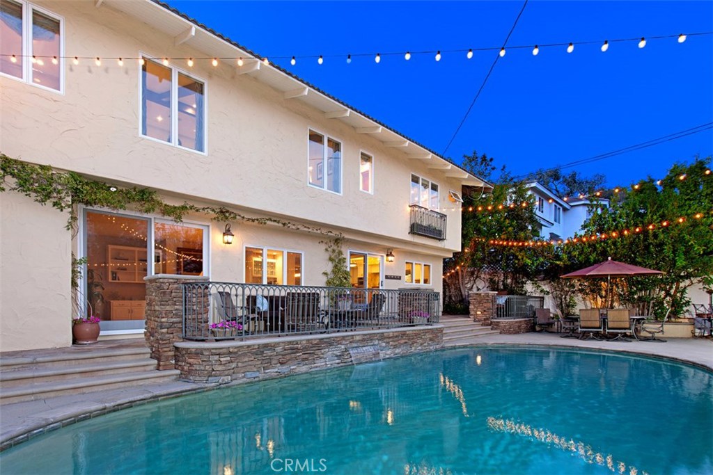 13032 St Thomas Drive North Tustin, CA 92705 - Photo 25 of 32 a view of a house with swimming pool and sitting area