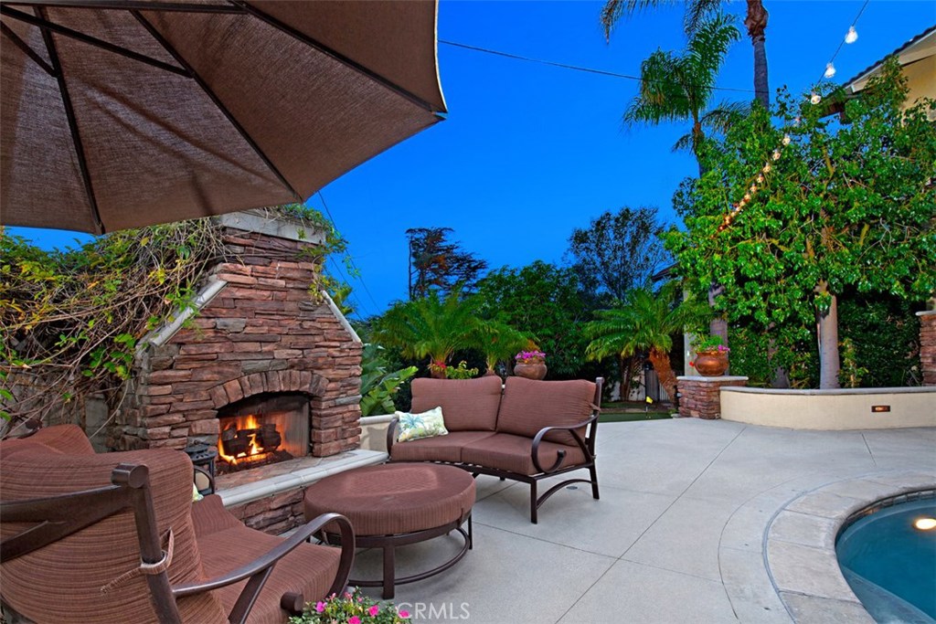 13032 St Thomas Drive North Tustin, CA 92705 - Photo 26 of 32 a patio with table and chairs and potted plants