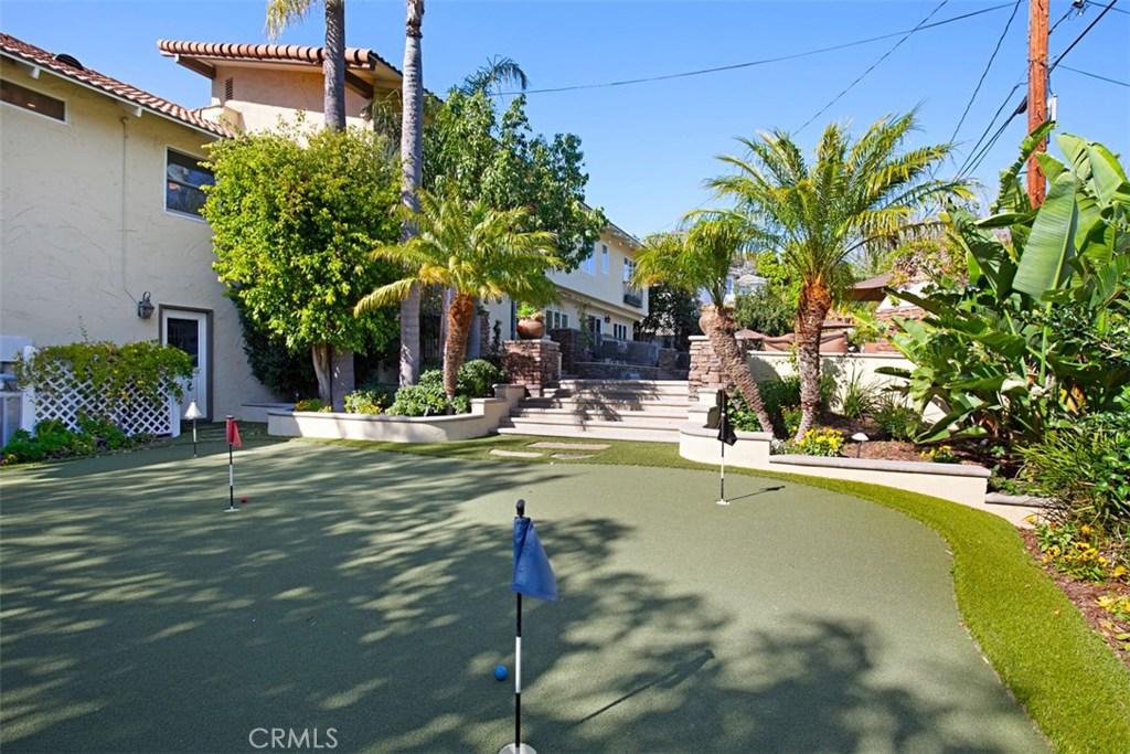 13032 St Thomas Drive North Tustin, CA 92705 - Photo 28 of 32 a swimming pool with outdoor seating and yard
