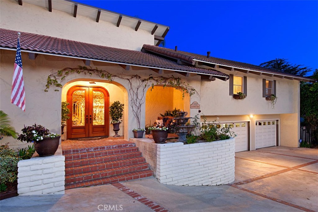 13032 St Thomas Drive North Tustin, CA 92705 - Photo 32 of 32 a front view of a house with a garden
