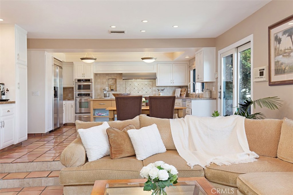 13032 St Thomas Drive North Tustin, CA 92705 - Photo 9 of 32 a living room with furniture wooden floor and a large window