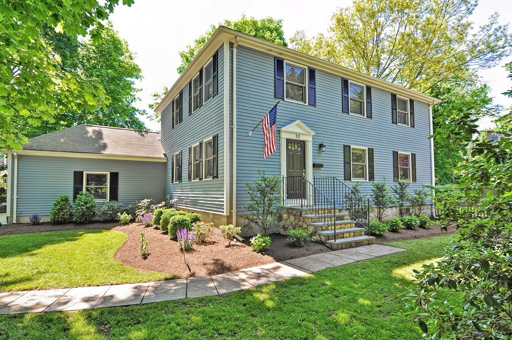 10 Pilgrim Road Wellesley, MA 02481 - Photo 1 of 25 a front view of a house with a yard and outdoor seating