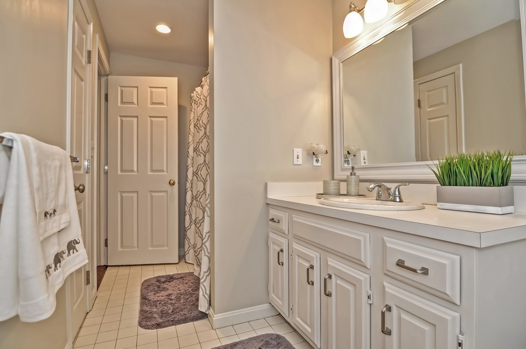 10 Pilgrim Road Wellesley, MA 02481 - Photo 16 of 25 a bathroom with a sink and a mirror