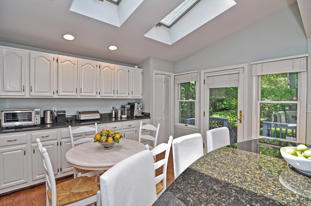 10 Pilgrim Road Wellesley, MA 02481 - Photo 7 of 25 a living room with kitchen island furniture and a wooden floor