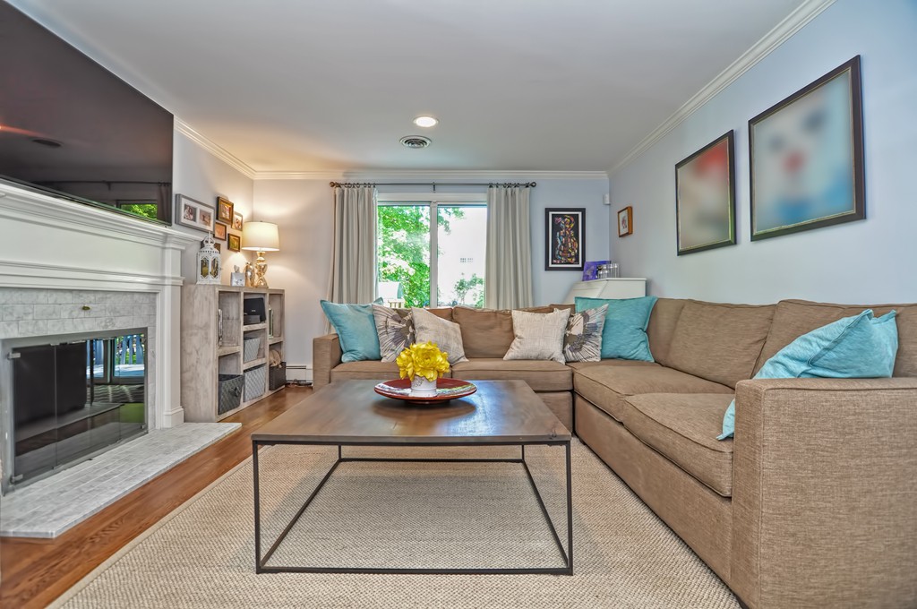 10 Pilgrim Road Wellesley, MA 02481 - Photo 8 of 25 a living room with furniture and a fireplace