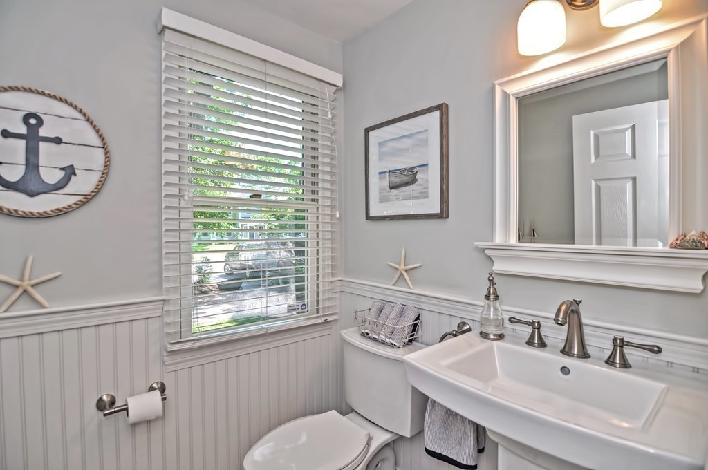 10 Pilgrim Road Wellesley, MA 02481 - Photo 9 of 25 a bathroom with a toilet a sink and a mirror