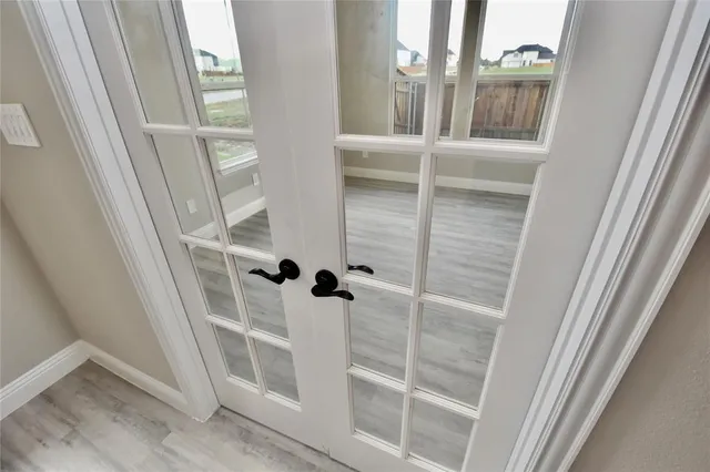a view of staircase with white walls and a window