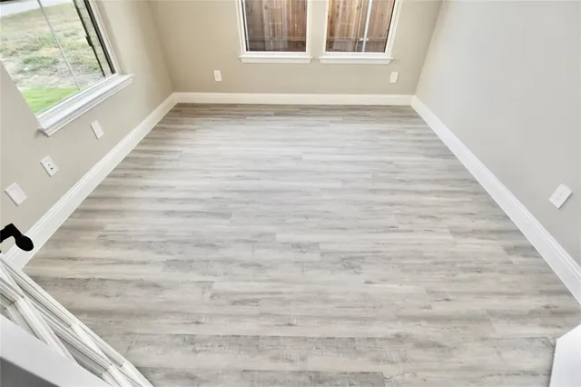 a view of an empty room and window