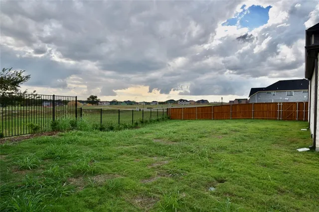 a large building with garden in front of it