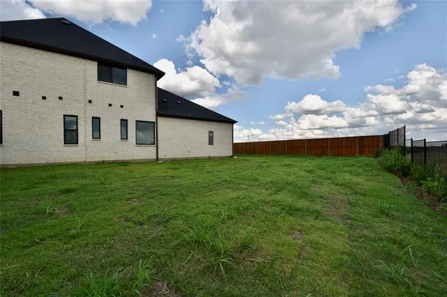a kitchen with stainless steel appliances kitchen island wooden floors and view living room