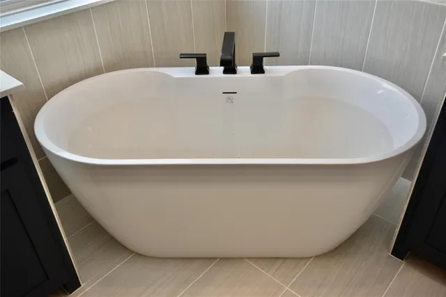 a bathroom with a sink vanity mirror and toilet