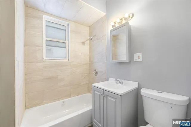 a bathroom with a sink a toilet and a bathtub