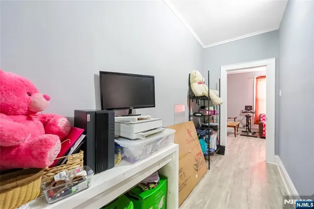 a room with furniture and a flat screen tv