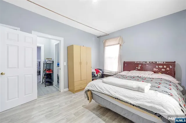 a bedroom with a bed and a closet