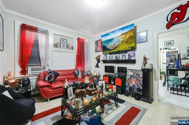a living room with furniture a rug and a window