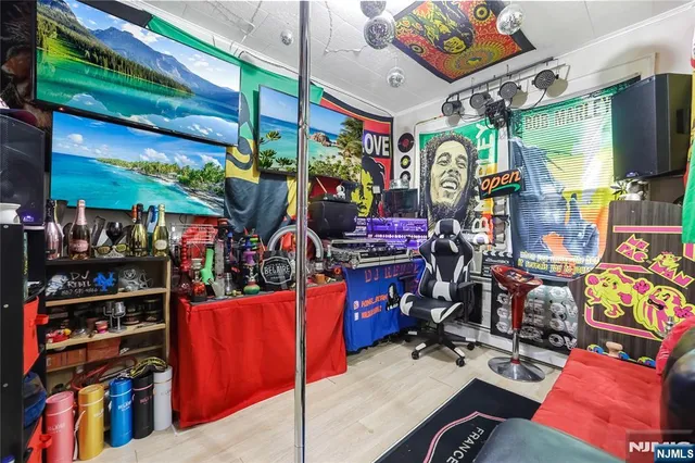 a bed room with a bed and a television