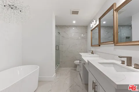 a white bath tub sitting in a bathroom