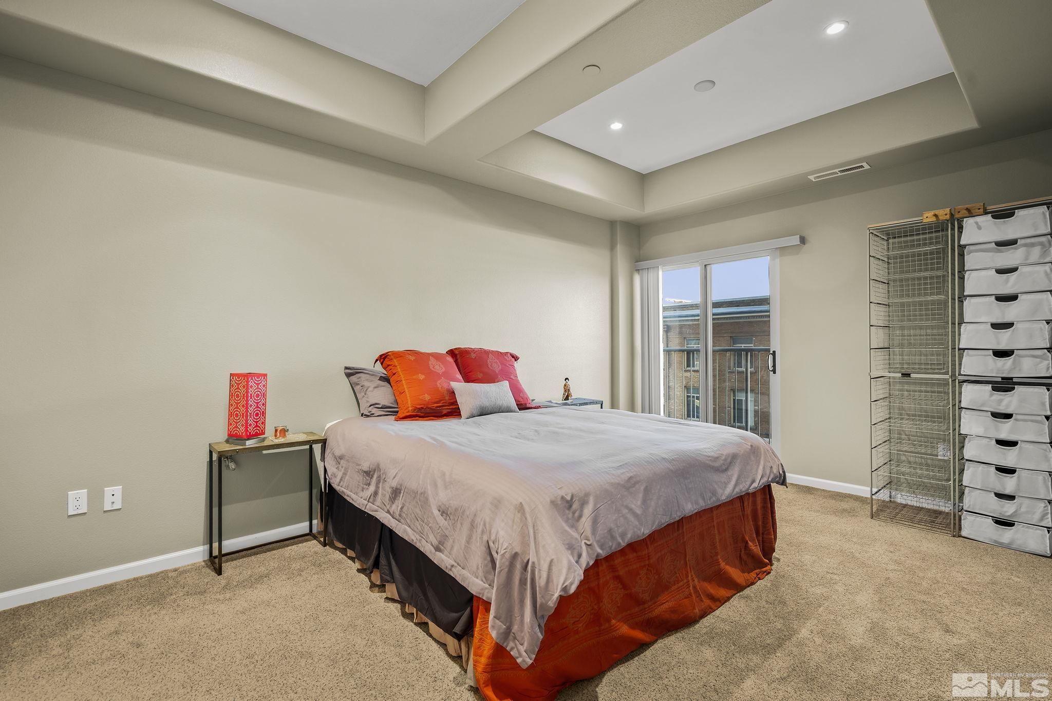 200 West 2nd Street, Unit 202 Reno, NV 89501 - Photo 13 of 18 a bedroom with a bed and dresser