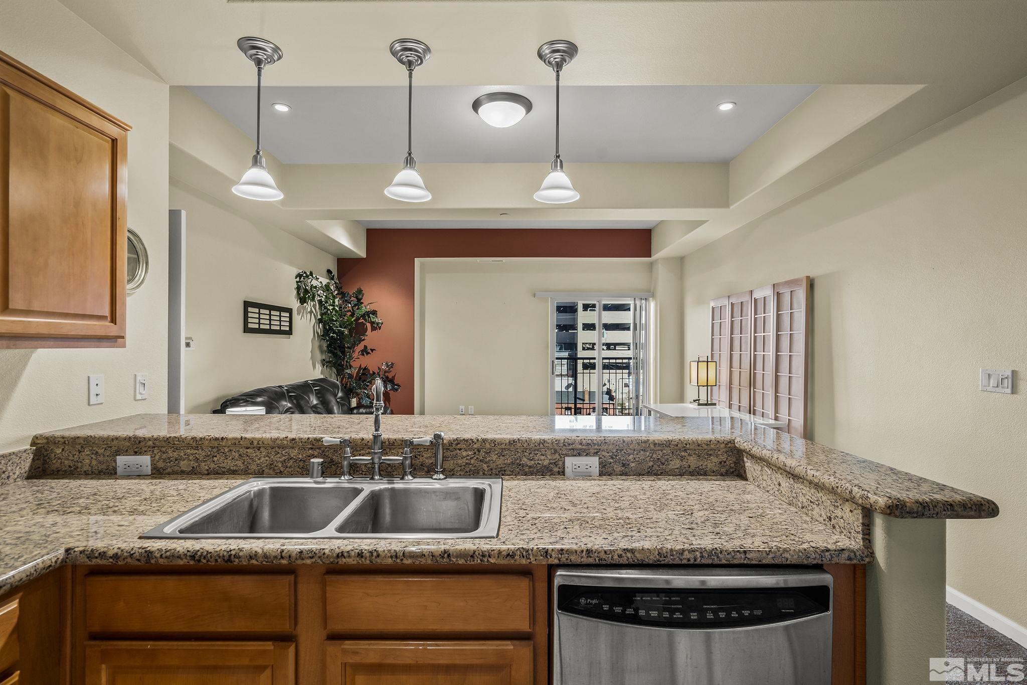 200 West 2nd Street, Unit 202 Reno, NV 89501 - Photo 5 of 18 a kitchen with a sink a counter space and windows