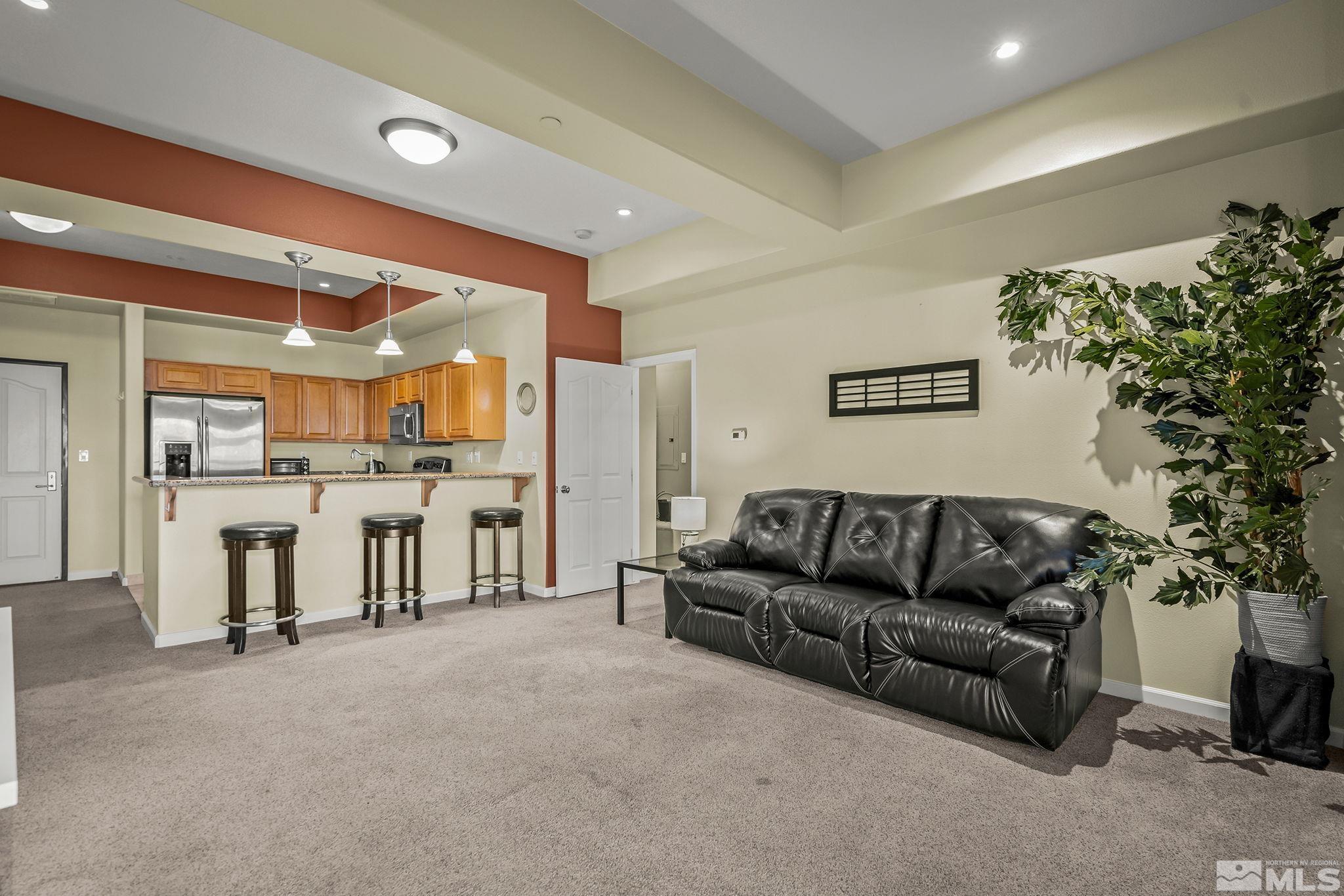200 West 2nd Street, Unit 202 Reno, NV 89501 - Photo 10 of 18 a living room with furniture and a potted plant
