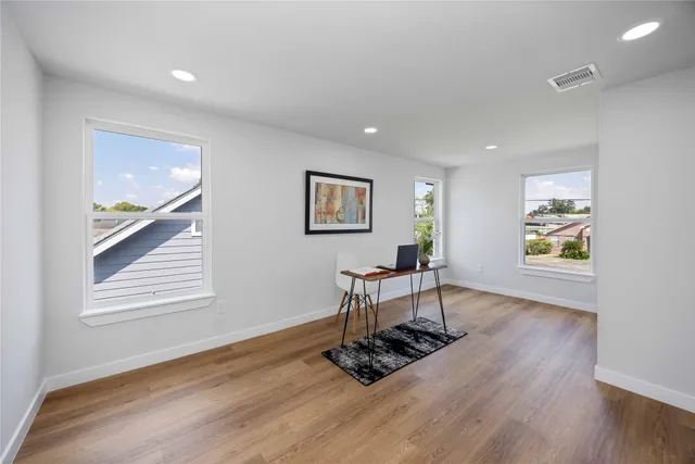 a view of a livingroom with furniture and wooden floor