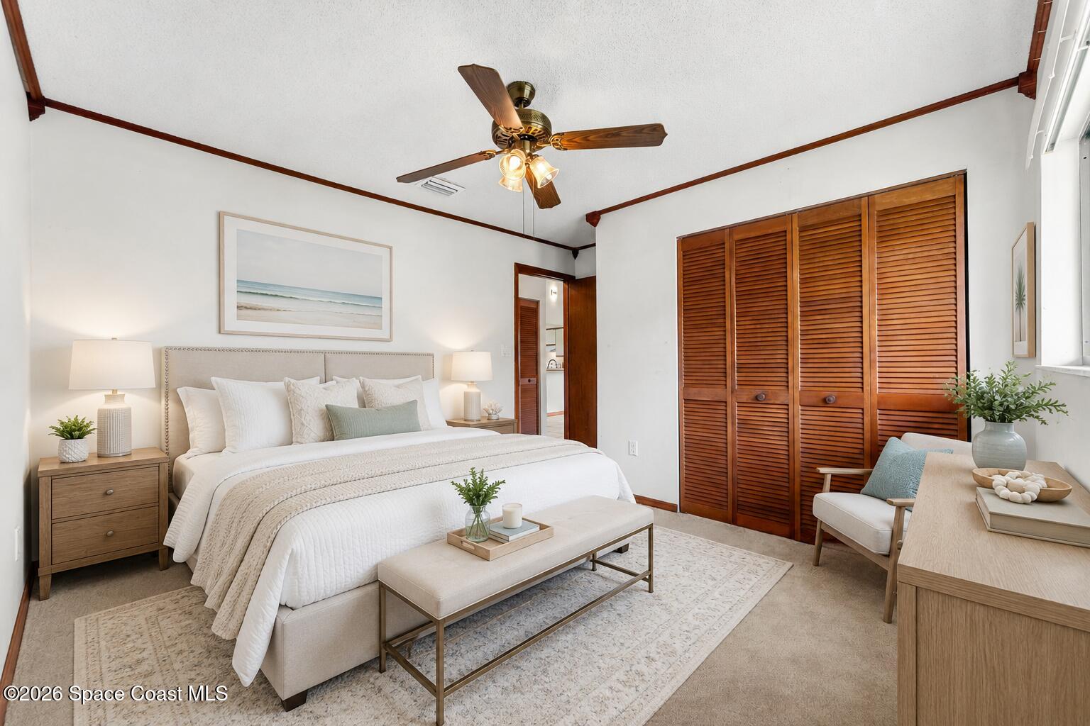 3121 Kirkland Road Northeast Palm Bay, FL 32905 - Photo 29 of 52 a bedroom with a bed a couch and a potted plant
