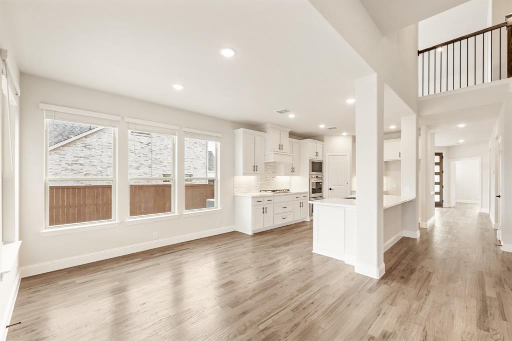 2304 Prosper Way Mansfield, TX 76063 - Photo 14 of 39 a big room with wooden floor and windows