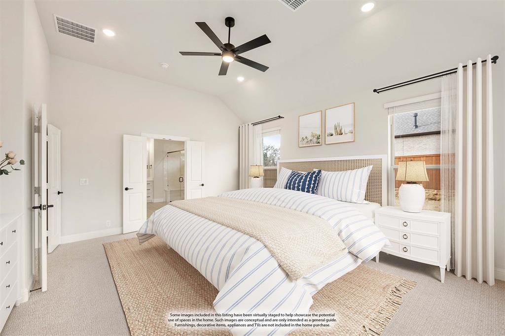 2304 Prosper Way Mansfield, TX 76063 - Photo 22 of 39 a bedroom with a large bed and a chandelier