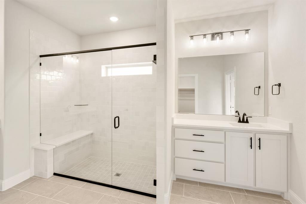 2304 Prosper Way Mansfield, TX 76063 - Photo 24 of 39 a bathroom with a shower sink and mirror