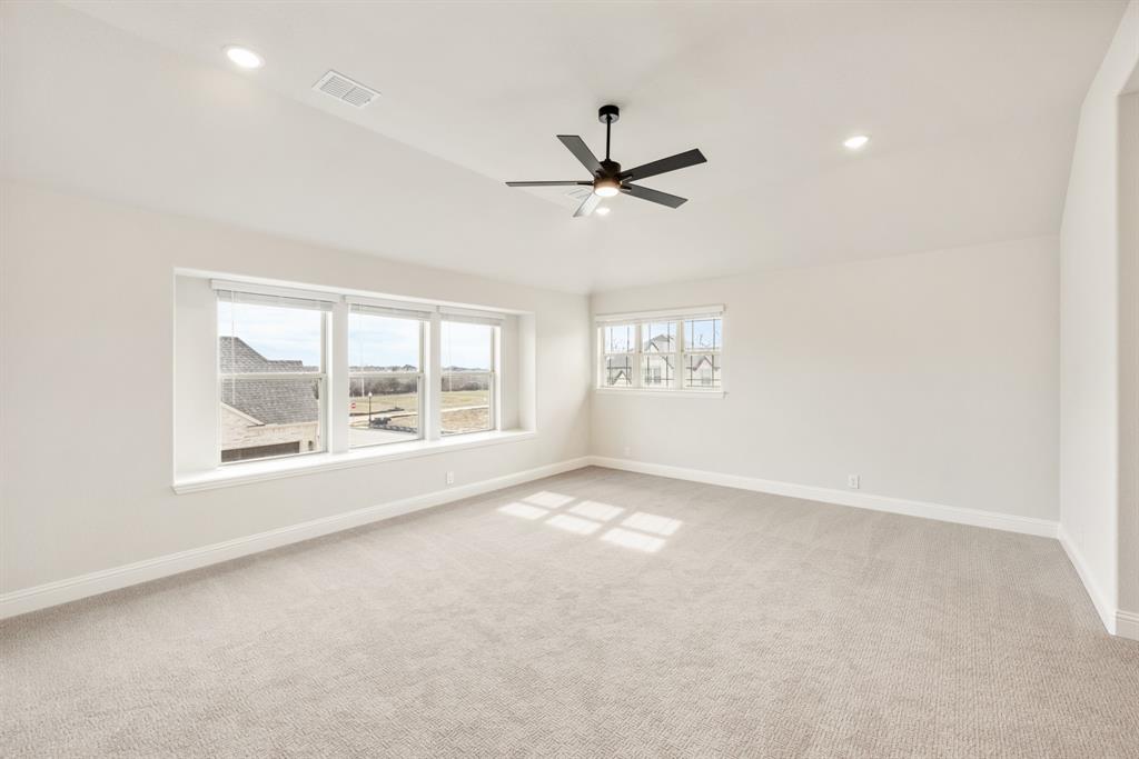 2304 Prosper Way Mansfield, TX 76063 - Photo 27 of 39 a view of an empty room with a window