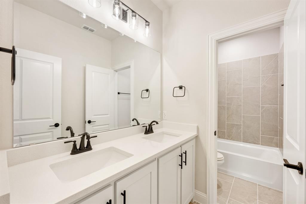 2304 Prosper Way Mansfield, TX 76063 - Photo 33 of 39 a bathroom with a sink and a mirror