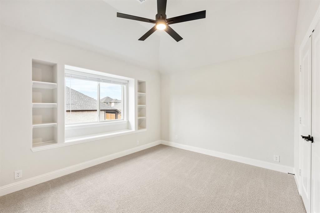 2304 Prosper Way Mansfield, TX 76063 - Photo 34 of 39 an empty room with a window and a fan
