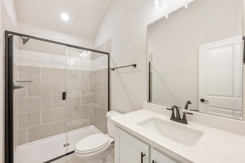 2304 Prosper Way Mansfield, TX 76063 - Photo 35 of 39 a bathroom with a sink a toilet and shower