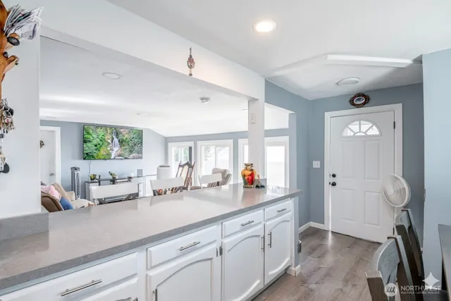 a view of a double vanity sink mirror and window