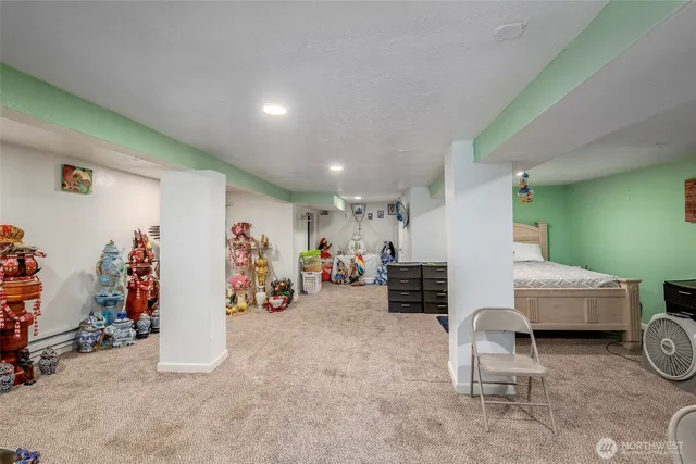 a view of a livingroom with furniture and a garage
