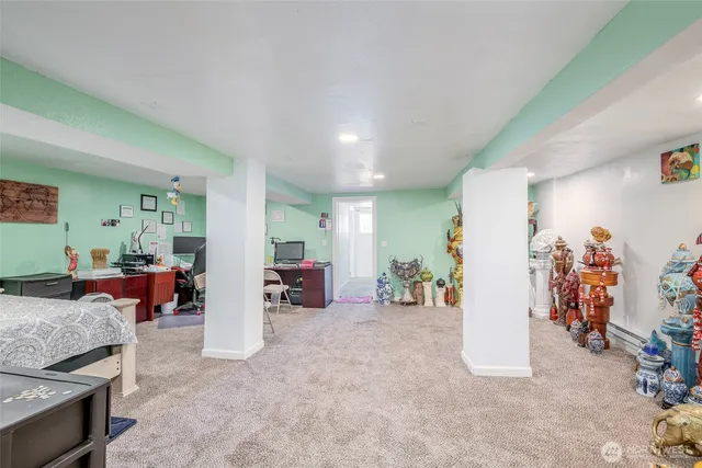 a view of a livingroom with furniture and a flat screen tv