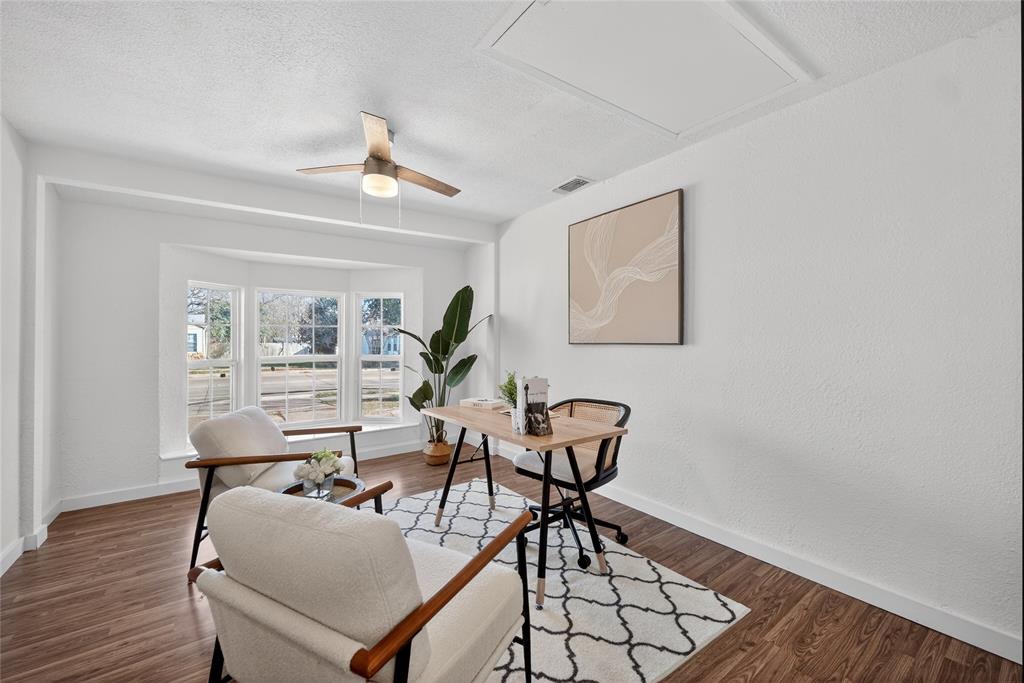 3417 Haltom Road Haltom City, TX 76117 - Photo 13 of 31 a workspace with furniture and wooden floor