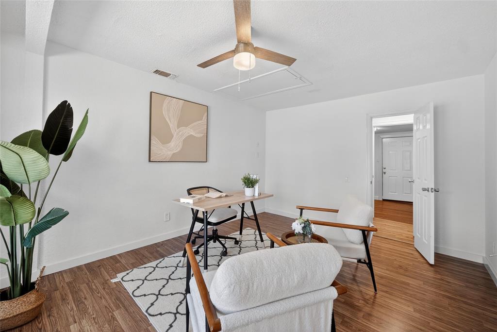 3417 Haltom Road Haltom City, TX 76117 - Photo 15 of 31 a view of a dining room with furniture and wooden floor