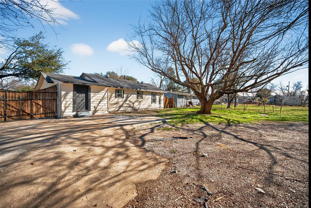 3417 Haltom Road Haltom City, TX 76117 - Photo 26 of 31 a view of a house with a yard