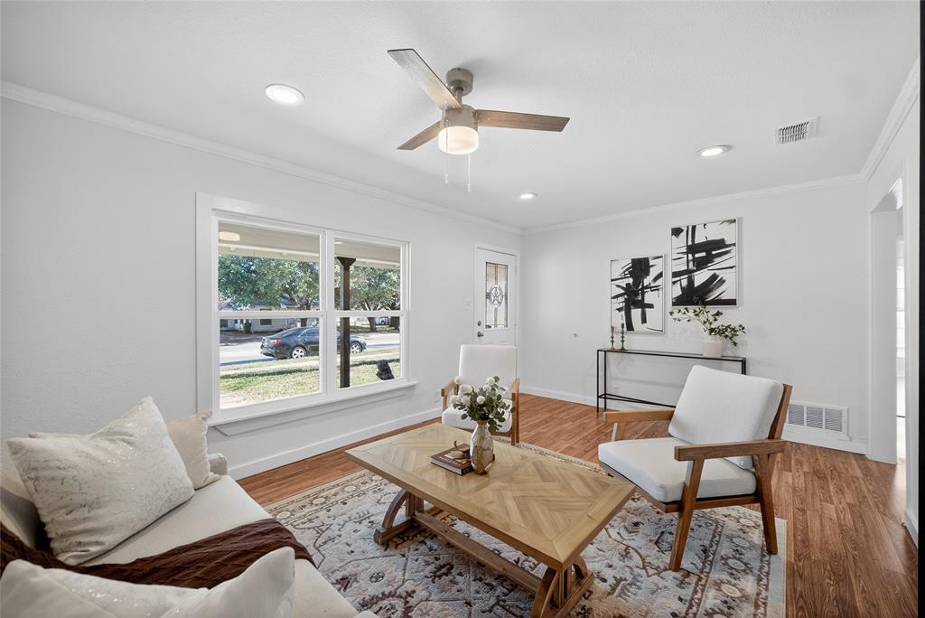 3417 Haltom Road Haltom City, TX 76117 - Photo 8 of 31 a living room with furniture and a large window