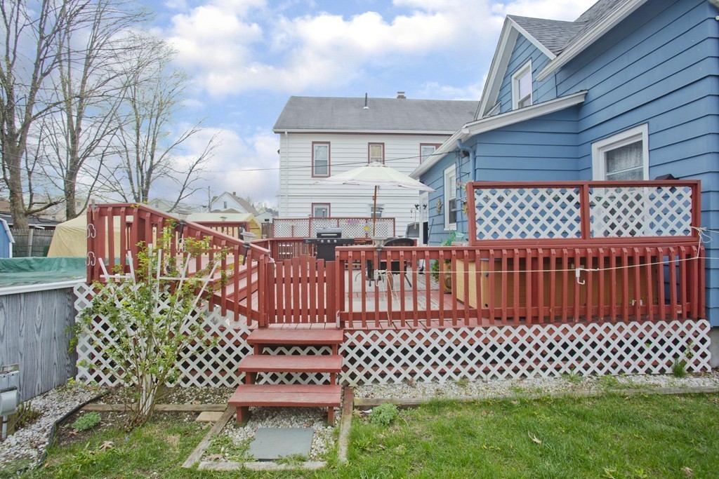 27 Governor Street Springfield, MA 01104 - Photo 13 of 18 a view of a brick house with wooden fence