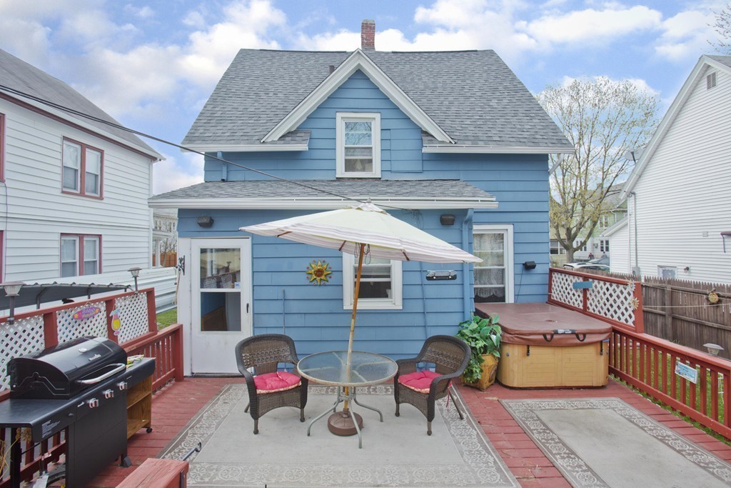 27 Governor Street Springfield, MA 01104 - Photo 15 of 18 a front view of a house with outdoor seating