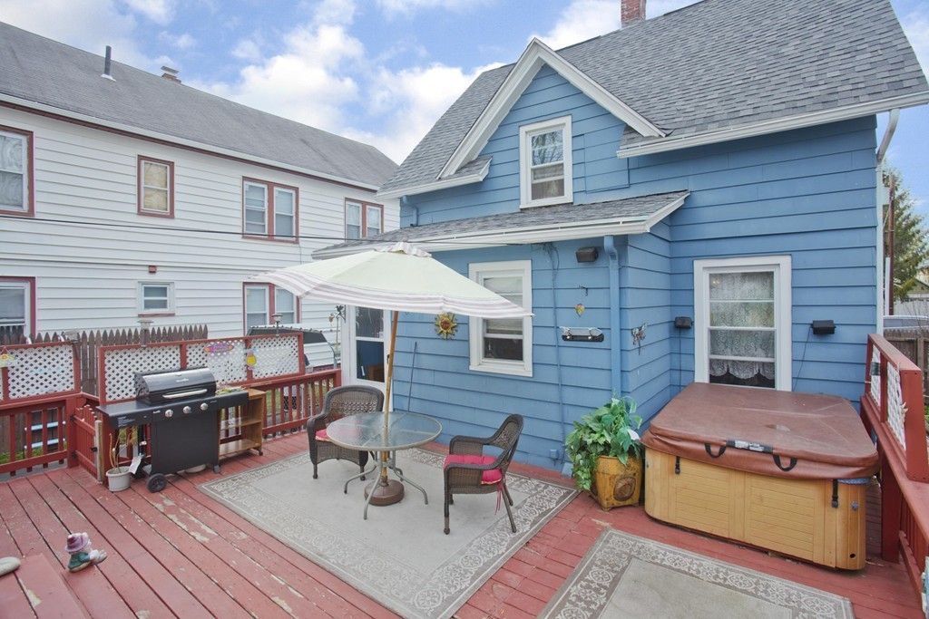 27 Governor Street Springfield, MA 01104 - Photo 16 of 18 a backyard of a house with seating space