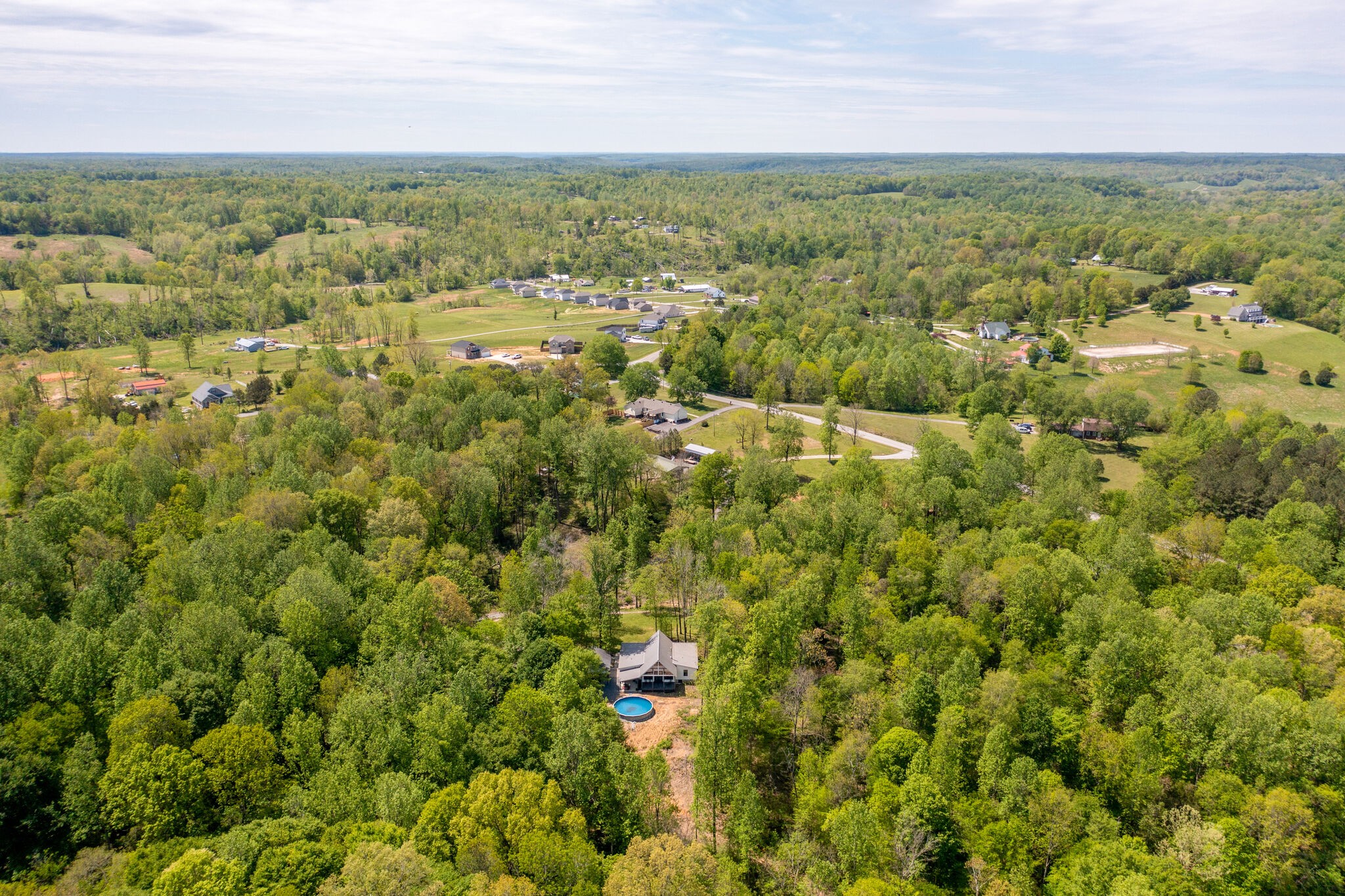 981 East Piney Road Dickson, TN 37055 - Photo 54 of 55 an aerial view of residential houses with outdoor space and trees