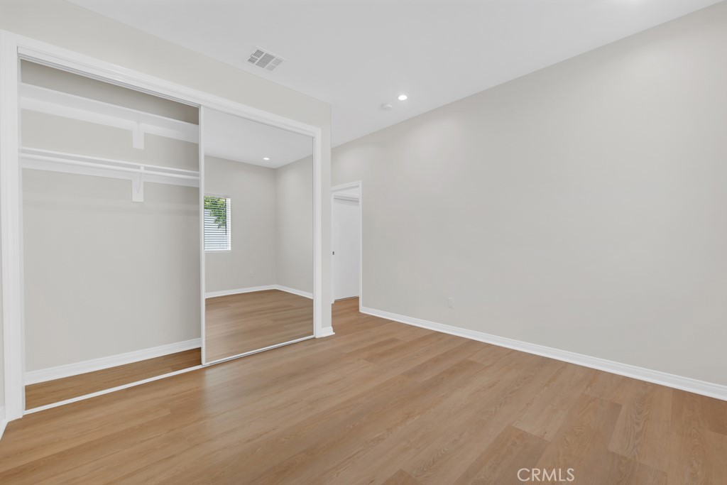 19104 Blackhawk Street Porter Ranch, CA 91326 - Photo 16 of 30 wooden floor in an empty room