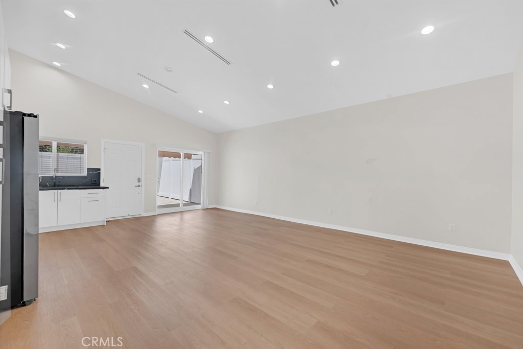 19104 Blackhawk Street Porter Ranch, CA 91326 - Photo 9 of 30 a view of empty room with wooden floor